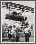 Photograph of suspended automobile body in the Chrysler Pavilion production ride
