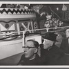 Photograph of riders admiring the It's a Small World amusement