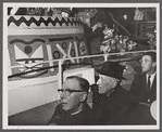 Photograph of riders admiring the It's a Small World amusement