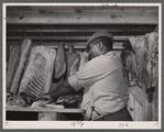 Butcher carving meat