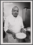 Foodservice worker presenting pie