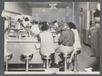 Patrons seated in diner