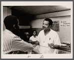 Frederick Wilson conversing at Nandlal's Restaurant