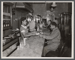 Waitress serving patrons at My Shade Restaurant