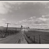 Many Vermont farms lie close to the highways. This one is near Westfield, Vermont.