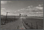 Many Vermont farms lie close to the highways. This one is near Westfield, Vermont.