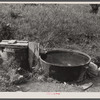Old iron kettle as watering trough. Near Lowell, Vermont.