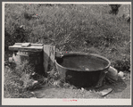 Old iron kettle as watering trough. Near Lowell, Vermont.