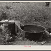 Old iron kettle as watering trough. Near Lowell, Vermont.