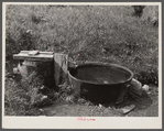 Old iron kettle as watering trough. Near Lowell, Vermont.