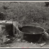 Old iron kettle as watering trough. Near Lowell, Vermont.