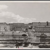 Amoskeag mills as seen from Bridge Street showing supports of Bridge Street from McGregor Street side, the upper structure of which was carried away in the March floods of the Merrimack River.