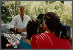 Bernard Hassell talking with film crew