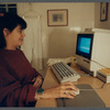 Karen Thorsen at computer