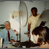 Older man with mustache being filmed