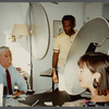Older man with mustache being filmed