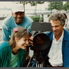 Film crew looking into camera