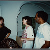 Woman in black talking with film crew