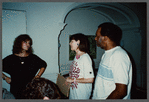 Woman in black talking with film crew