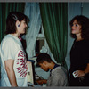 Woman in black talking with film crew