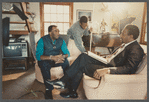 Man in suit and striped tie being filmed