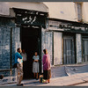 Film crew talking to woman in doorway in Paris