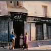 Film crew talking to woman in doorway in Paris