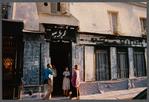 Film crew talking to woman in doorway in Paris