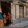 Film crew talking to woman in doorway in Paris