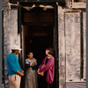 Film crew talking to woman in doorway in Paris