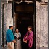 Film crew talking to woman in doorway in Paris