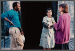 Film crew talking to woman in doorway in Paris