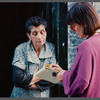 Karen Thorsen talking to woman in doorway in Paris