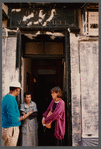 Film crew talking to woman in doorway in Paris