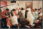 Churchgoers stand during filming at Central Holiness Church of God