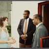 Karen Thorsen talking to two men in suits