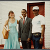 Karen Thorsen stands with two men while laughing