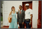 Karen Thorsen stands with two men while laughing