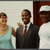 Karen Thorsen stands with two men while laughing
