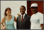 Karen Thorsen stands with two men while laughing