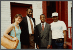 Karen Thorsen standing with three men