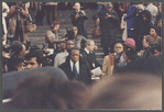 David Baldwin standing amid crowd at James Baldwin's funeral