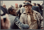 Attendees greet each other at James Baldwin's funeral