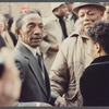 Attendees greet each other at James Baldwin's funeral