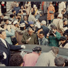 Crowd gathering around limo at James Baldwin's funeral