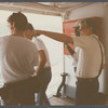 Film crew looking out across water