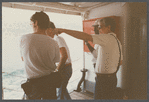 Film crew looking out across water