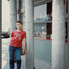 Turkish child leaning against pillar