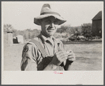 Rehabilitation client rolling a cigarette. Gage County, Nebraska.