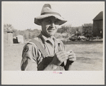 Rehabilitation client rolling a cigarette. Gage County, Nebraska.